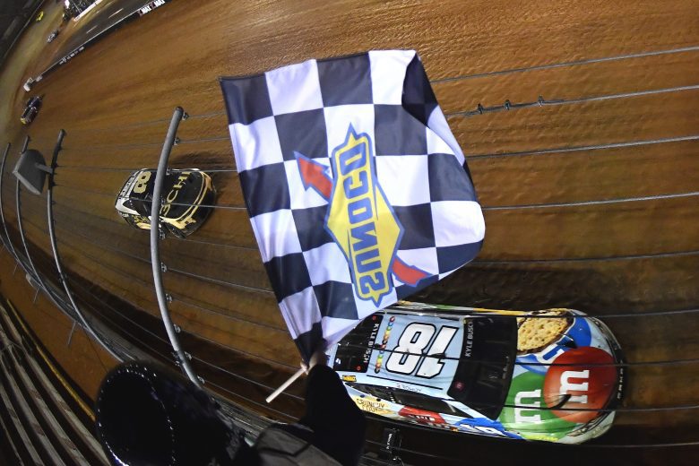 A photo of Kyle Busch taking the checkered flag
